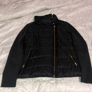 black jacket, gold zippers